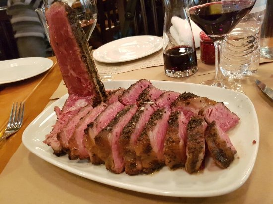 Chi Spacca signature dishes Bistecca Alla Fiorentina, Grilled Octopus, Tomahawk Pork Chop.
